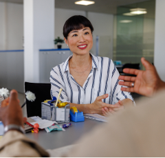 A woman sits in a meeting